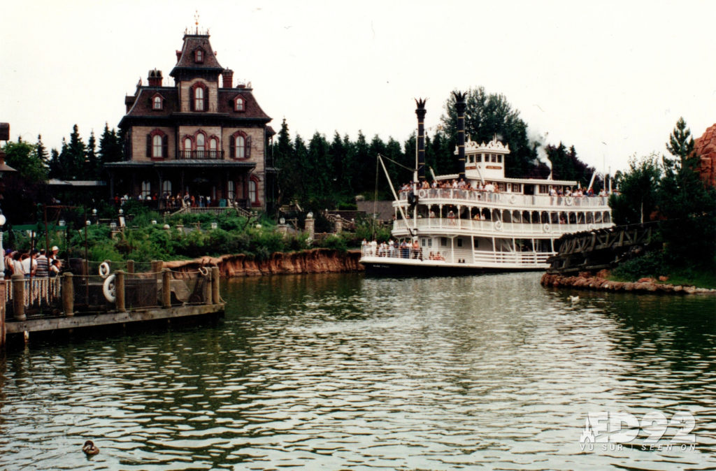 The Mark Twain sails around Big Thunder MOuntain, past Phantom Manor before docking at Thunder Mesa Riverboat Landing