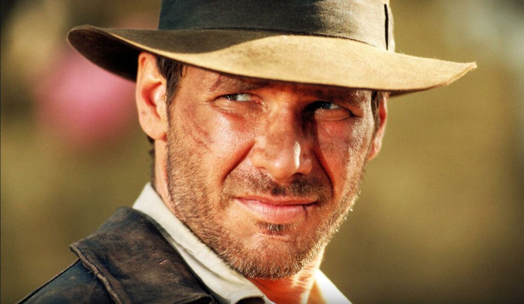 Indiana Jones, played by actor Harrison Ford, wearing his leather jacket and hat