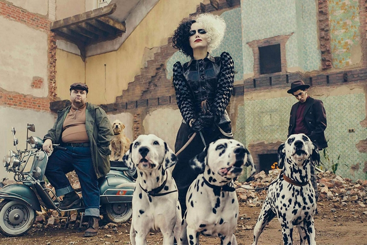 Cruella holding Dalmatians on a leash and surrounded by Jasper and Horace