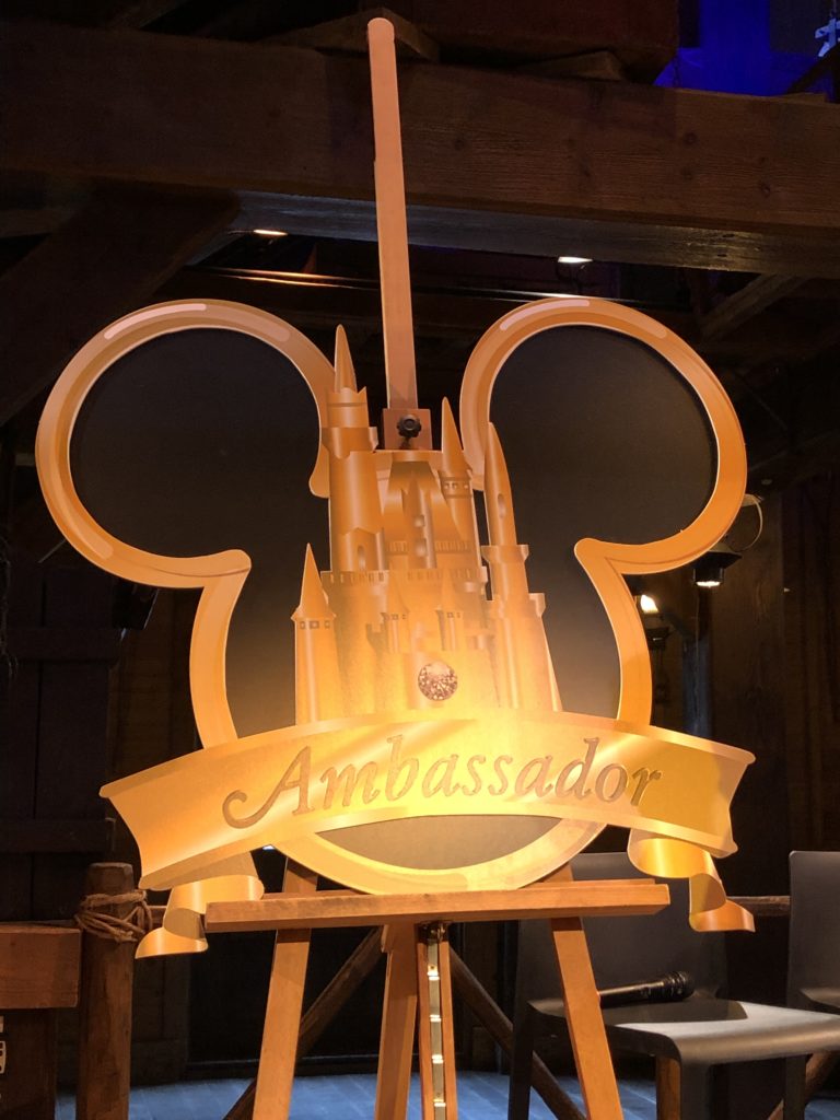 The disneyland paris ambassador logo on a tripod